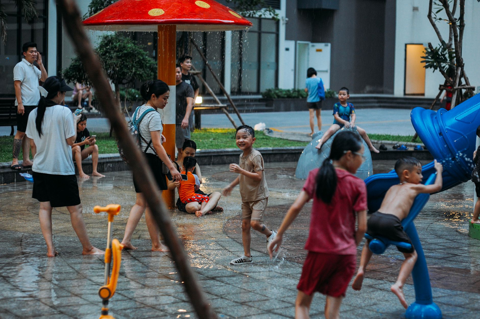 Kids and families enjoying a playful day at an outdoor water park.